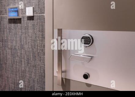 Large metal safe door with multiple access control devices for opening Stock Photo