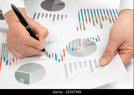 Workplace businessman. Charts, and graphs on the desk. Business concepts. Stock Photo