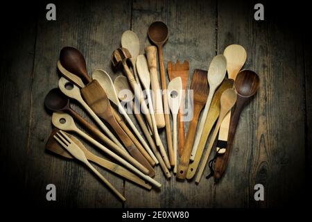 Different Wooden Spoons On Deal Board Floor, Topview Stock Photo