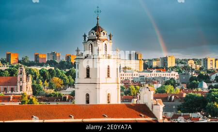 Vilnius, Lithuania. Sunset Cityscape Of Vilnius, Lithuania In Summer. Beautiful View Of Old Town In Evening. Sts Johns' Church Sv. Jonu baznycia Stock Photo