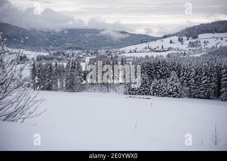 the snow-covered village of bernau in the black forest in germany. Stock Photo