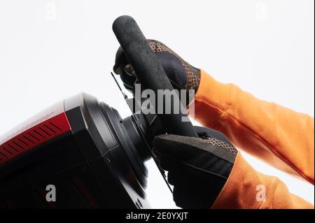 Spinning car sport wheel with hands in gloves isolated side view Stock Photo