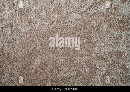 Light brown fluffy background. Surface of wool beige color rug Stock Photo