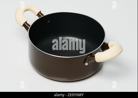 Brown metal cooking pot side view isolated on white background Stock Photo