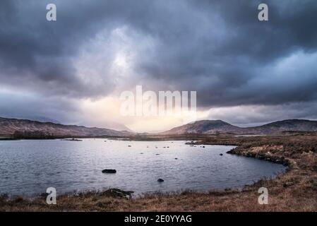 Epic landscape image of Loch Ba on Rannoch Moor in Scottish Highlands on a Winter morning