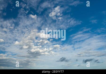 Light white clouds in blue sunny sky Stock Photo