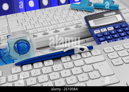Workplace with calculator and PC two keyboards close up Stock Photo