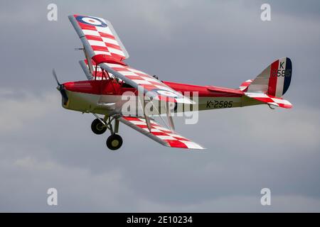 De Havilland DH.82 Tiger Moth aircraft in flight in Royal air force markings, Cambridgeshire, England, United Kingdom, Europe Stock Photo