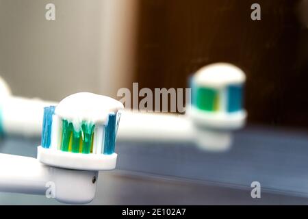 Toothbrush with toothpaste, an electric toothbrush close-up. Toothbrush head close-up. Oral hygiene. Stock Photo