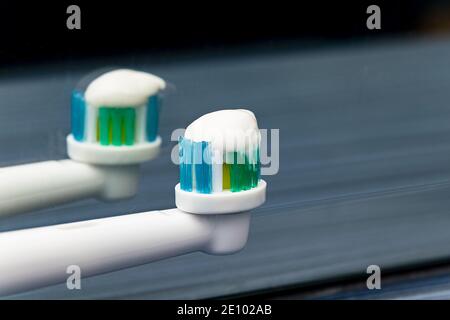 Toothbrush with toothpaste, an electric toothbrush close-up. Toothbrush head close-up. Oral hygiene. Stock Photo