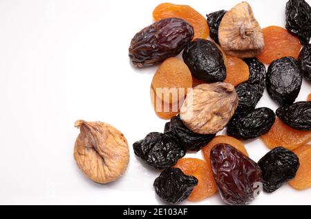 Various dried fruits on white background. Healthy food concept. Copy space, top view. Stock Photo