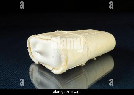 The Icecream in waffles rests upon glass table with reflection. Products of the feeding on black background Stock Photo