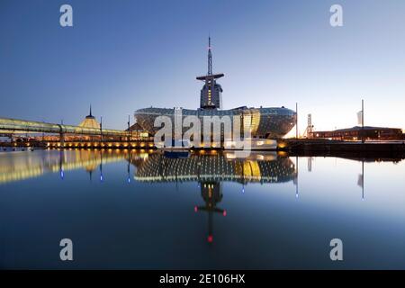 Illuminated Klimahaus Bremerhaven in the evening, Havenwelten, Bremerhaven, Federal State of Bremen, Germany, Europe Stock Photo