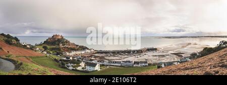 Mont Orgueil Castle, or Gorey Castle, has cast its imposing shadow over the beautiful fishing port of Gorey for more than 800 years. Stock Photo