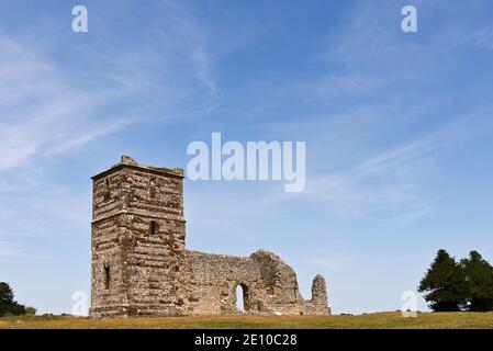 A daytime picture of Knowlton church in Dorset, England, UK on an overcast day. Picture shows some of the earthwork rings that surround the church. Stock Photo