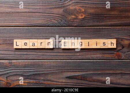 learn english word written on wood block. learn english text on table, concept. Stock Photo