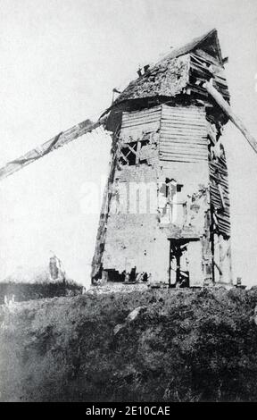 A historical view of the Hébuterne windmill damaged by fighting during the Battle of Hébuterne, Pas-de-Calais. France. Taken from a postcard c. 1915. Stock Photo