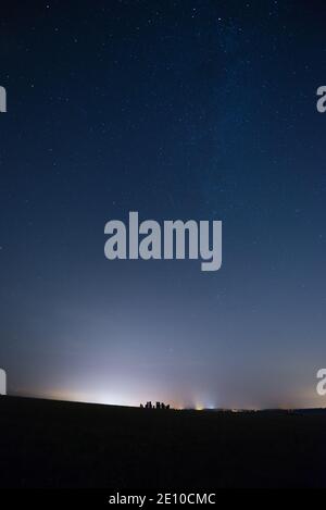 The night sky over Stonehenge in Wiltshire, England, UK during the annual Perseid meteor showers. Stock Photo