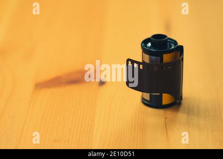 Close up shot of a 35mm negative camera film on a wooden background Stock Photo