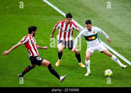 Bilbao, Spain. January, 2021. Jose Antonio Morente of Elche C.F is surrounded by Yuri Berchiche and Raul Garcia of Athletic Club players during the La Liga match between Athletic Club Bilbao vs Elche CF played at San Mames Stadium. Credit: Ion Alcoba/Capturasport/Alamy Live News Stock Photo