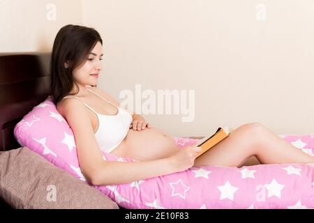 Woman in Lingerie Sitting Reading a Book Our beautiful pictures