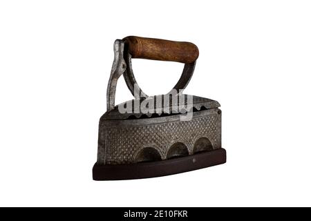 old vintage antique iron with wooden handle isolated on white background Stock Photo