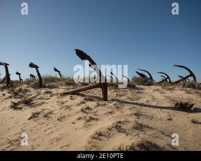 Anchor cemetery graveyard Cemiterio das Ancoras rusting memorial at Praia do Barril Ilha de Tavira near Santa Luzia Algarve Portugal Stock Photo