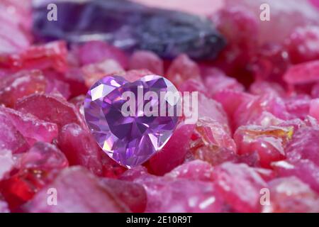 heart amethyst diamonds on raw ruby rough gemstone Stock Photo - Alamy