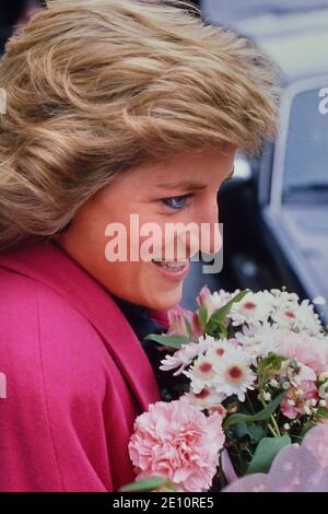 A smiling Diana, Princess of Wales receiving a bouquet of flowers during a visit to the Relate Marriage Guidance Centre in Barnet, north London, 29th November 1988 Stock Photo