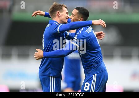 Leicester City's Youri Tielemans (right) celebrates scoring his side's second goal of the game with team-mate Marc Albrighton during the Premier League match at St James' Park, Newcastle. Stock Photo