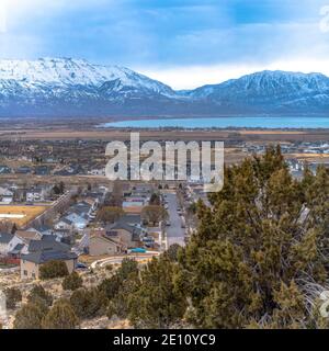 Aerial view of a snowy residential neighborhood featuring apartment ...