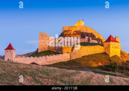 Rupea (Brasov County), Romania. Ruins of Rupea Fortress at the evening light. Stock Photo