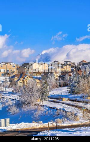 Homes in luxurious neighborhood in Highland Utah with cloudy blue sky background Stock Photo