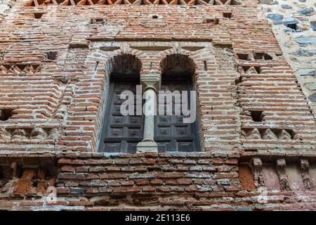 Ancient medieval window in the old town of Caceres. Extremadura. Spain.