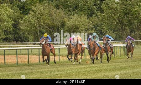 Magdeburg, Germany - 24 June 2017: Tough fight between the jockeys riding race horses. Race track in Magdeburg Stock Photo
