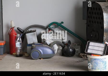 Messy storage room in garage for junk in old house Stock Photo