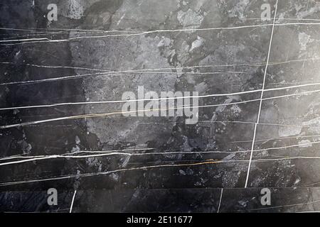 Artificial stone backdrop is similar to natural. It can look like onyx or marble or granite or any other black stone. Close-up. Stock Photo