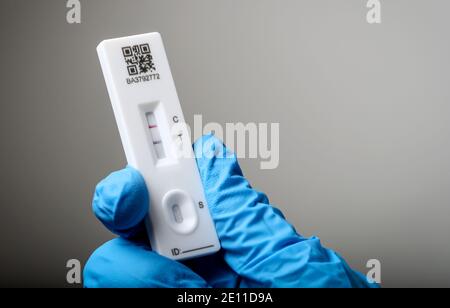 Coronavirus test using a Lateral Flow Device, the test shows a positive result, the patient has coronavirus. Stock Photo