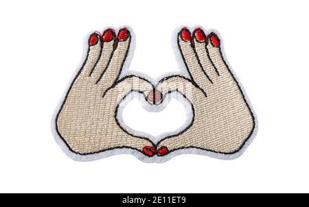 Hands making heart shape, embroidered batch isolated on white background Stock Photo