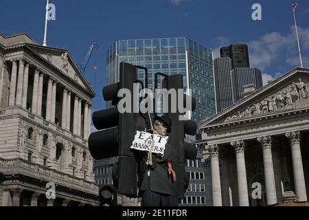 GREAT BRITAIN / England / London / A mannequin dressed as a banker is hanged from traffic light post outside the Bank of England during G20 protest. Stock Photo