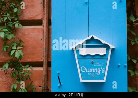 Blue and white postbox on the blue background with the place for your text Stock Photo