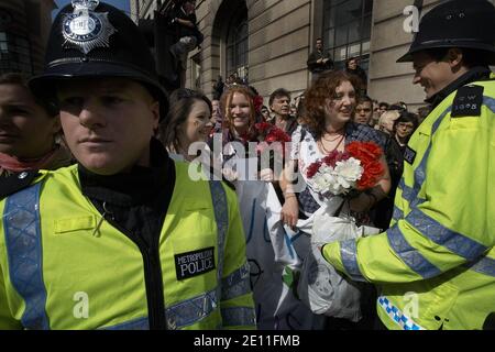 GREAT BRITAIN / England / London /Protesters with flowers outside the Bank of England at anti capitalist and climate change protest. Stock Photo