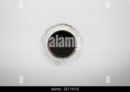 Old hole for a chimney in a wall - close-up Stock Photo
