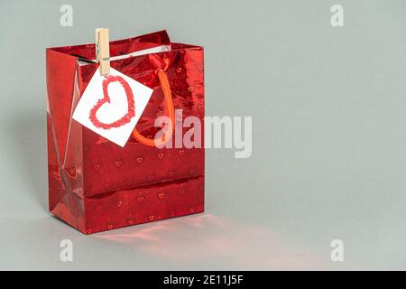red gift package on a gray background. high quality Stock Photo