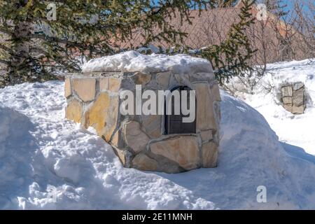 Stone mailbox of house in the residential community of Park City Utah in winter Stock Photo