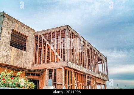 House under construction against cloudy blue sky in Long Beach California Stock Photo