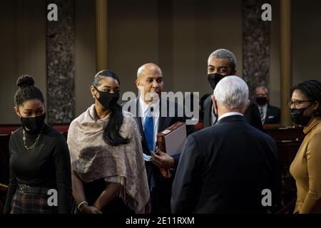 Washington, United States. 03rd Jan, 2021. Vice President Mike Pence speaks with Senator Cory Booker (D-NJ) and his family, during a mock swearing-in ceremony in the Old Senate Chamber on Capitol Hillon Sunday, January 3, 2021 in Washington, DC. Pool photo by Pete Marovich/UPI Credit: UPI/Alamy Live News Stock Photo