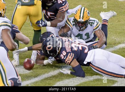 November 21, 2021: Chicago, Illinois, U.S. - Bears #36 DeAndre  Houston-Carson tackles Ravens #89 Mark Andrews during the NFL Game between  the Baltimore Ravens and Chicago Bears at Soldier Field in Chicago