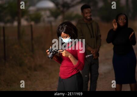 a young female photographer in africa Stock Photo