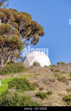 White geometric round structure with blue sky background in San Diego California Stock Photo